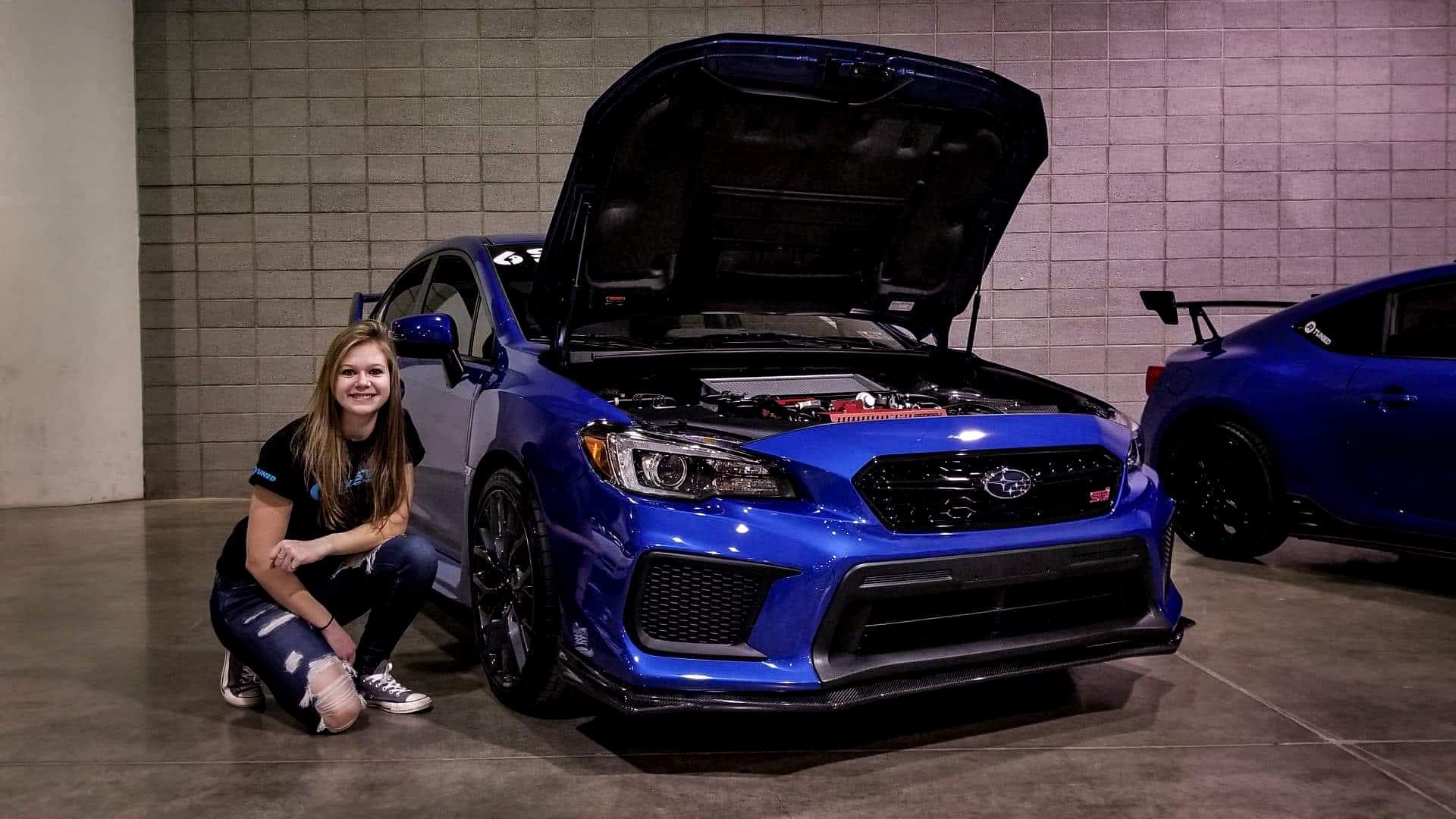 Picture of Kylie and her Subaru