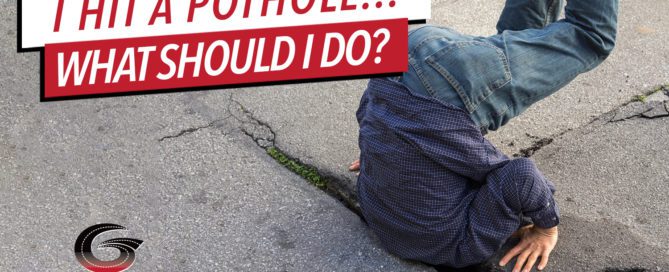 Man stuck in pothole
