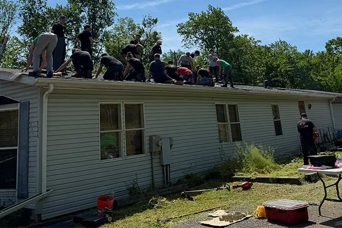 Working on a roof for Hosanna Industries